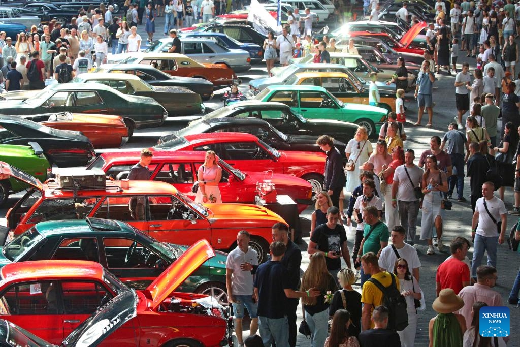 Visitors view cars at a vintage car exhibition in Minsk, Belarus, Aug. 30, 2025. The exhibition opened here on Saturday, showcasing more than 400 restored vehicles. (Photo: Xinhua)
