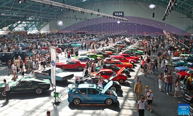 Visitors view cars at a vintage car exhibition in Minsk, Belarus, Aug. 30, 2025. The exhibition opened here on Saturday, showcasing more than 400 restored vehicles. (Photo: Xinhua)