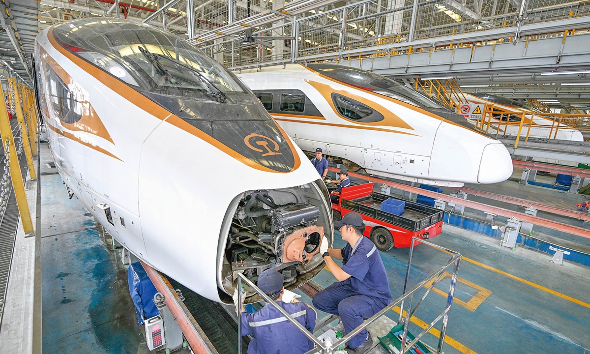 Workers conduct maintenance on a high-speed train in  Nanjing, East China's Jiangsu Province, on September 2, 2025. As of the end of 2024, China's high-speed railway network had reached 48,000 kilometers in total operating length, accounting for more than 70 percent of the global total and covering 97 percent of Chinese cities with populations exceeding 500,000. Photo: VCG
