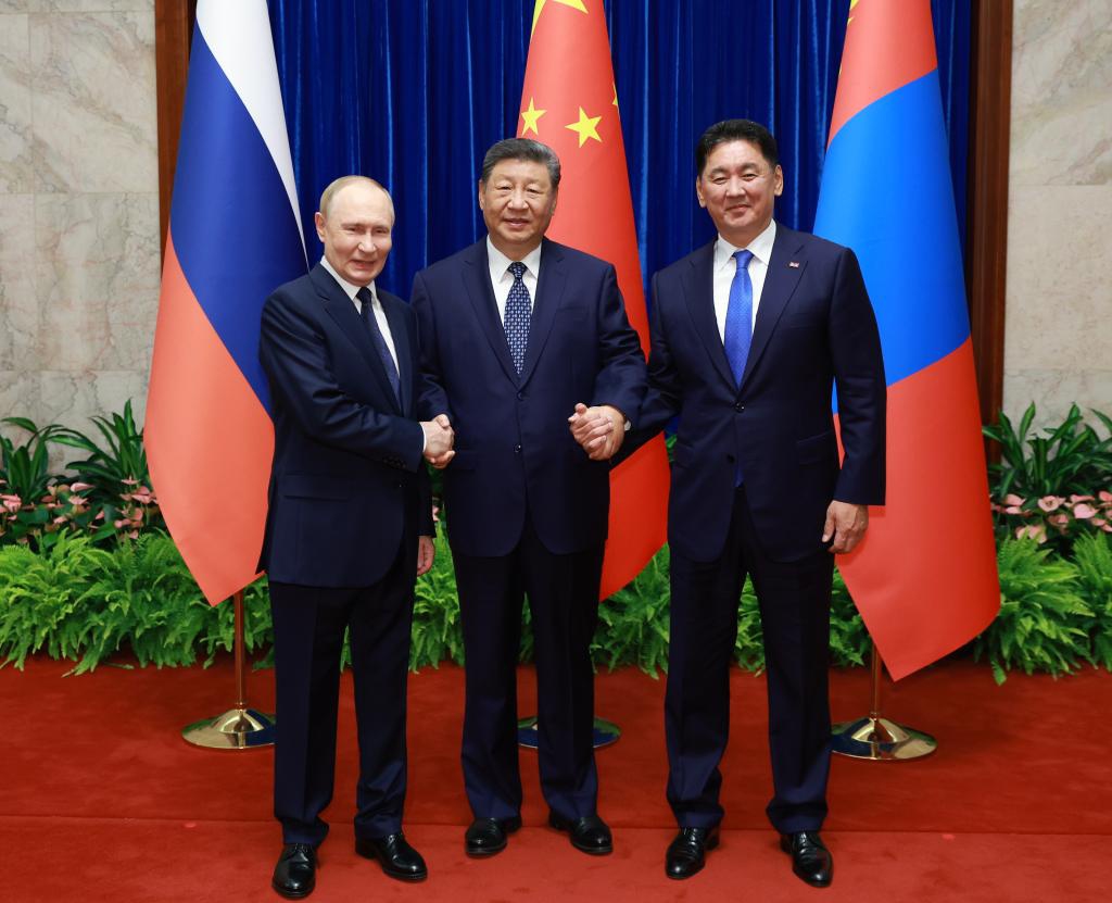 Chinese President Xi Jinping, Russian President Vladimir Putin and Mongolian President Ukhnaa Khurelsukh hold a trilateral meeting at the Great Hall of the People in Beijing, capital of China, Sept. 2, 2025. (Xinhua/Ding Haitao)