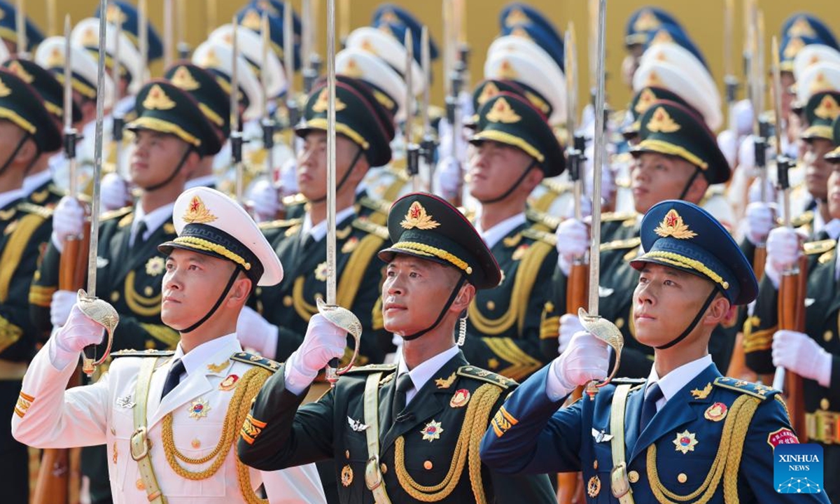 Honor guards stand in formation during a grand gathering to mark the 80th anniversary of the victory in the Chinese People's War of Resistance against Japanese Aggression and the World Anti-Fascist War in Beijing, capital of China, Sept. 3, 2025. (Xinhua/Wei Peiquan)