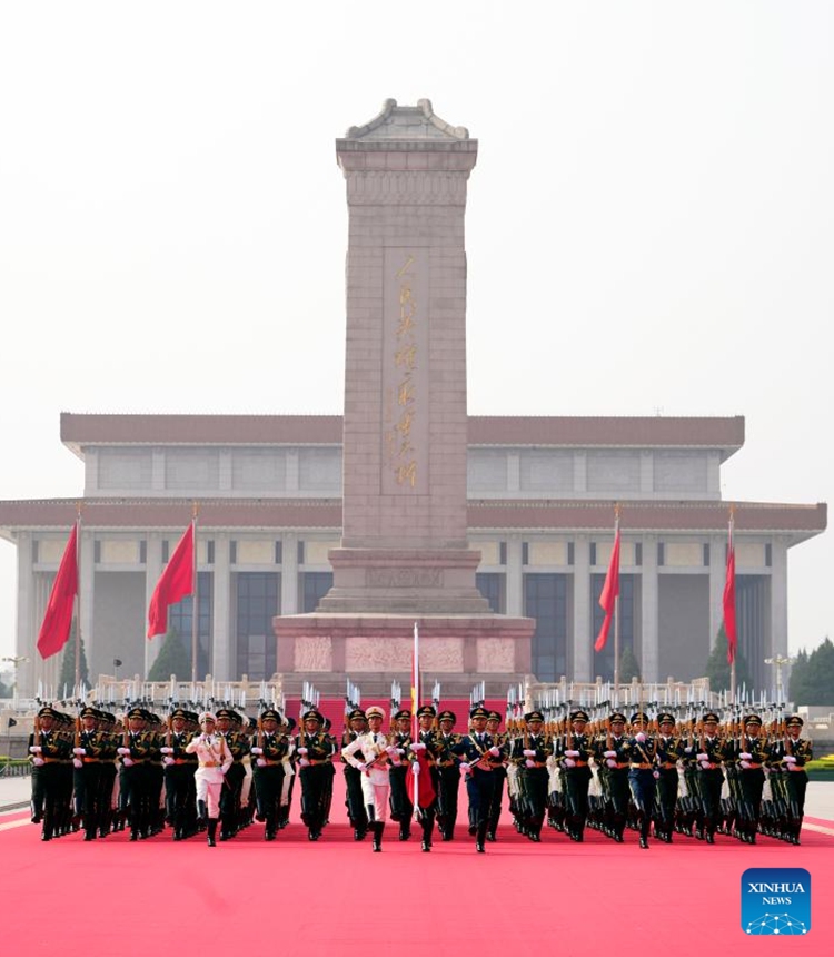 Honor guards escort the Chinese national flag during a grand gathering to mark the 80th anniversary of the victory in the Chinese People's War of Resistance against Japanese Aggression and the World Anti-Fascist War in Beijing, capital of China, Sept. 3, 2025. (Xinhua/Du Yu)