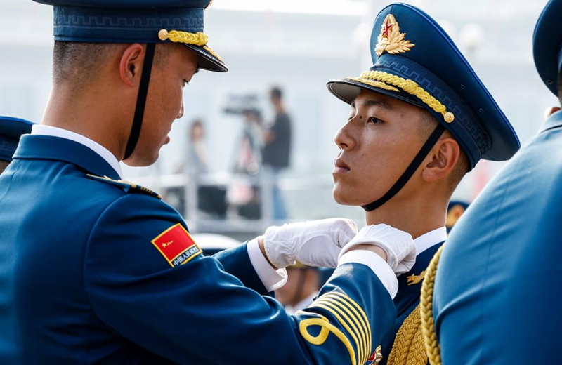 Members of the joint military band of the Chinese People's Liberation Army make preparations in Beijing, capital of China, Sept. 3, 2025. China on Wednesday held a grand gathering to commemorate the 80th anniversary of the victory in the Chinese People's War of Resistance against Japanese Aggression and the World Anti-Fascist War. (Xinhua/Zhang Yuwei)