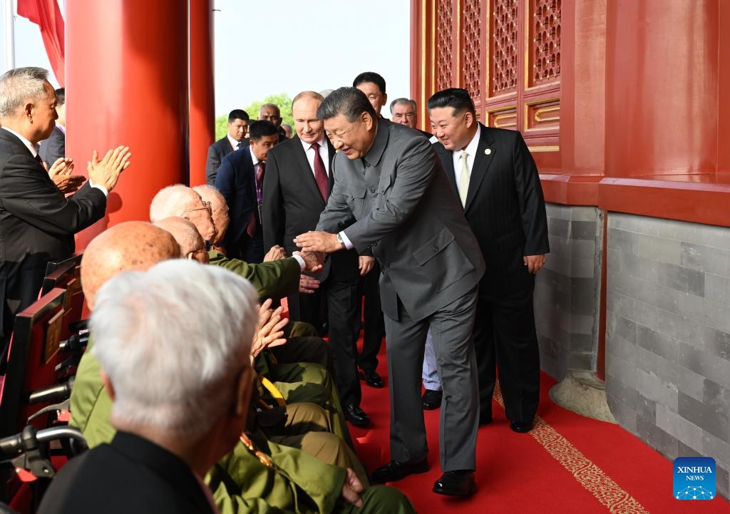 Chinese President Xi Jinping, also general secretary of the Communist Party of China Central Committee and chairman of the Central Military Commission, shakes hands with war veterans at Tian'anmen Rostrum in Beijing, capital of China, Sept. 3, 2025. China on Wednesday held a grand gathering to commemorate the 80th anniversary of the victory in the Chinese People's War of Resistance against Japanese Aggression and the World Anti-Fascist War. (Xinhua/Xie Huanchi)
