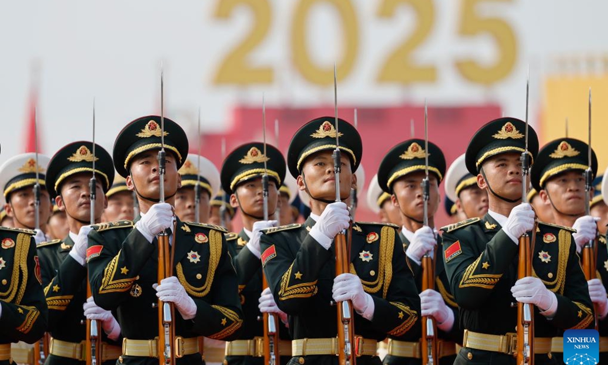 Honor guards stand in formation during a grand gathering to mark the 80th anniversary of the victory in the Chinese People's War of Resistance against Japanese Aggression and the World Anti-Fascist War in Beijing, capital of China, Sept. 3, 2025. (Xinhua/Fei Maohua)