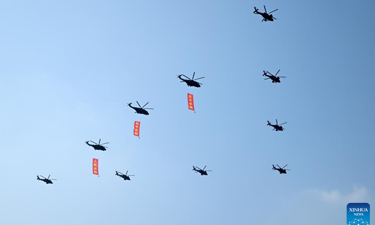 A flag-guarding echelon flies over Tian'anmen Square during a grand gathering to commemorate the 80th anniversary of the victory in the Chinese People's War of Resistance against Japanese Aggression and the World Anti-Fascist War in Beijing, capital of China, Sept. 3, 2025. (Xinhua/Xia Yifang)
