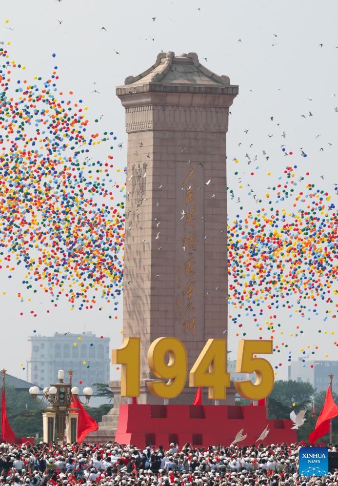 Pigeons and balloons are released during a grand gathering to commemorate the 80th anniversary of the victory in the Chinese People's War of Resistance against Japanese Aggression and the World Anti-Fascist War in Beijing, capital of China, Sept. 3, 2025. (Xinhua/Yin Gang)