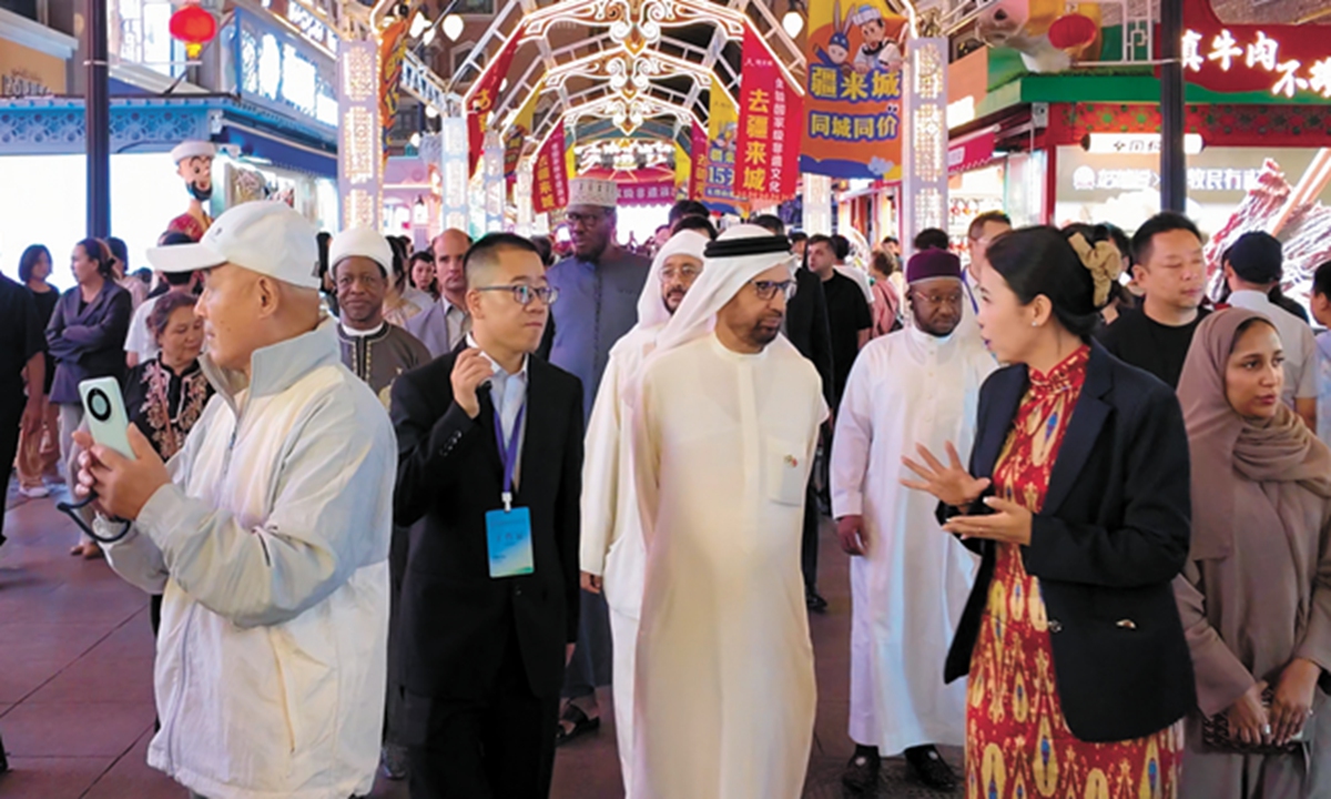 Foreign scholars and religious fgures from various countries - including the United Arab Emirates and Egypt visit the Xinjiang International Grand Bazaar in Urumqi, Northwest China's Xinjiang Uygur Autonomous Region, on August 25, 2025. Photo: Liu Xin/GT
