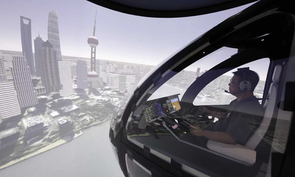 An engineer fine-tunes flight instruments on a simulator, on September 4, 2025. Shanghai-based Volant Aerotech Co recently launched pilot training on its VE25 engineering simulator, the first professional-grade electric vertical takeoff and landing (eVTOL) simulator in China. This cutting-edge simulator is set to provide critical experience and data for the entire eVTOL industry, supporting engineering tests, airworthiness certification, and flight training. Photo: VCG
