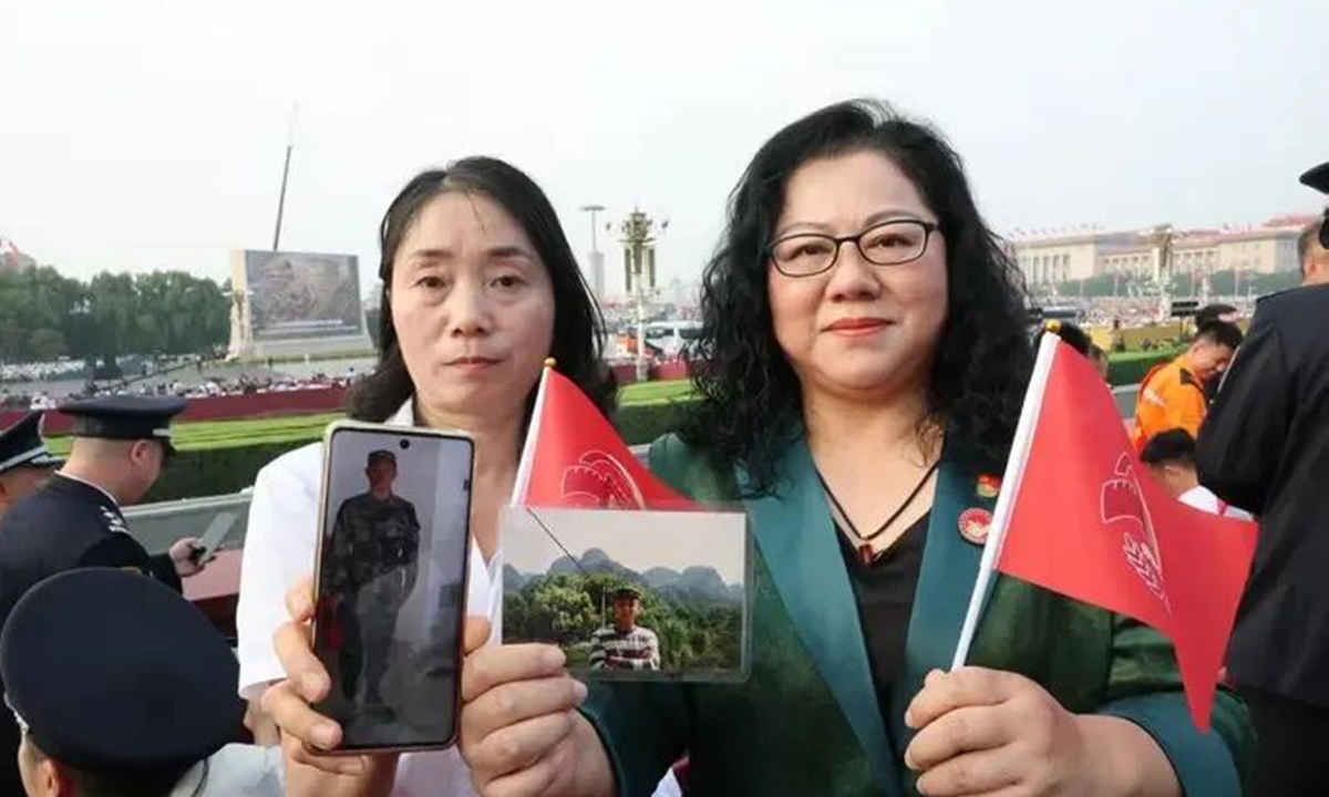 Yao Jiusui (left), mother of PLA martyr Chen Xiangrong, and Ruan Guoqin, wife of Chinese martyr pilot Wang Wei, pose for a photo at the military parade marking the 80th anniversary of the victory in the Chinese People's War of Resistance Against Japanese Aggression and the World Anti-Fascist War in Beijing on September 3, 2025. Photo: People's Daily's WeChat account 