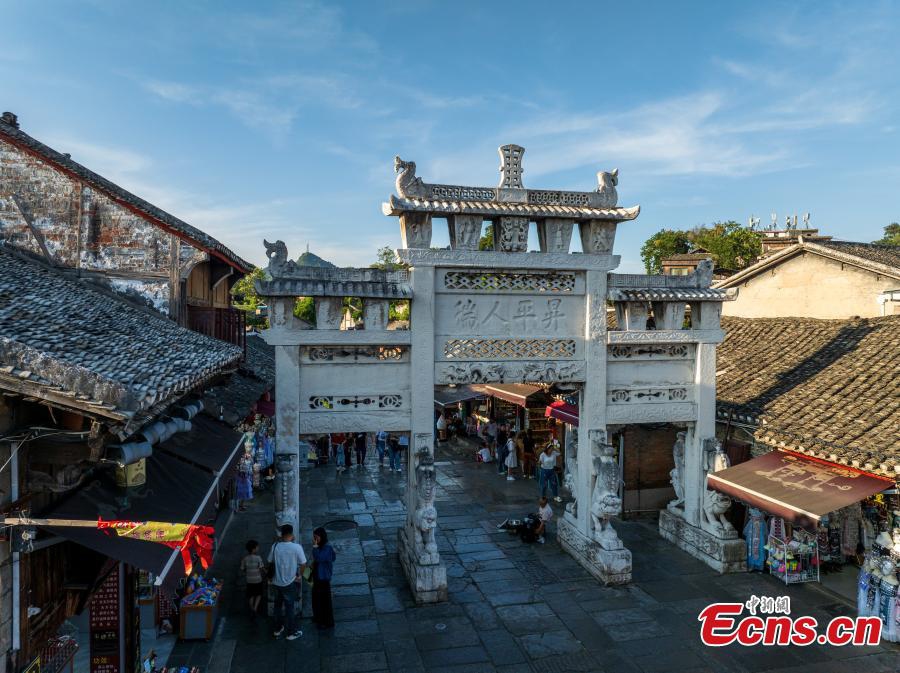 Tourists visit Qingyan ancient town in Guiyang City, southwest China's Guizhou Province on Sept. 3, 2025. Qingyan ancient town in Guizhou Province served as a key military stronghold during the Ming and Qing dynasties (1368-1911), with well-preserved ancient architecture scattered throughout the town.（Photo: Ecns.cn)