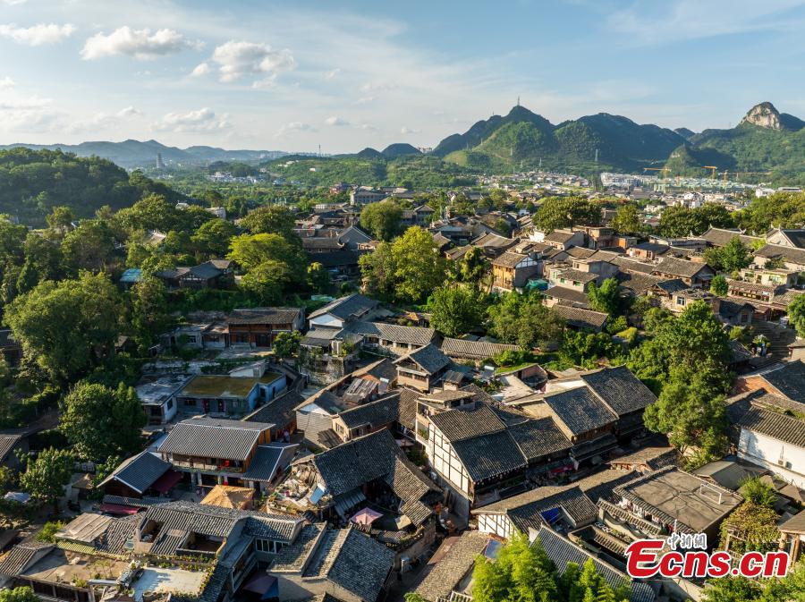Tourists visit Qingyan ancient town in Guiyang City, southwest China's Guizhou Province on Sept. 3, 2025. Qingyan ancient town in Guizhou Province served as a key military stronghold during the Ming and Qing dynasties (1368-1911), with well-preserved ancient architecture scattered throughout the town.（Photo: Ecns.cn)