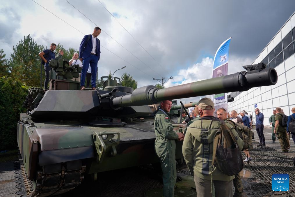 People visit the 33rd International Defence Industry Exhibition in Kielce, Poland on Sept. 3, 2025. The event runs from Tuesday to Friday, showcasing new achievements in military equipment development as well as cutting-edge technologies and systems for logistics, security and rescue. (Photo: Xinhua)