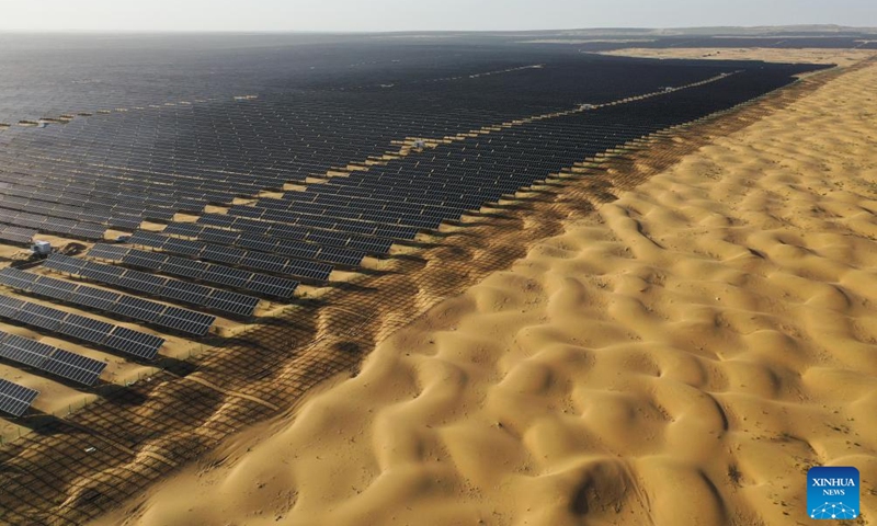 An aerial drone photo taken on Sept. 2, 2025 shows a new energy base in Kubuqi Desert, north China's Inner Mongolia Autonomous Region. In recent years, Inner Mongolia has carried out integrated projects for sand prevention and control as well as wind and photovoltaic power to advance the improvement efforts in Kubuqi Desert. To date, photovoltaic bases have been established in the northern part of Kubuqi Desert, which also serve as solid booster for local ecological rehabilitation and economic growth. (Photo: Xinhua)