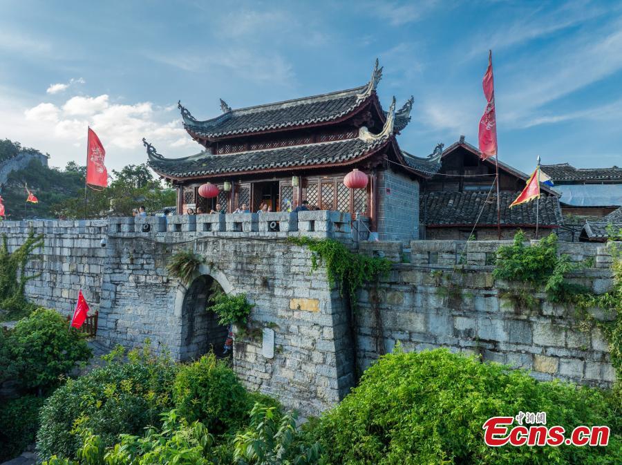 Tourists visit Qingyan ancient town in Guiyang City, southwest China's Guizhou Province on Sept. 3, 2025. Qingyan ancient town in Guizhou Province served as a key military stronghold during the Ming and Qing dynasties (1368-1911), with well-preserved ancient architecture scattered throughout the town.（Photo: Ecns.cn)