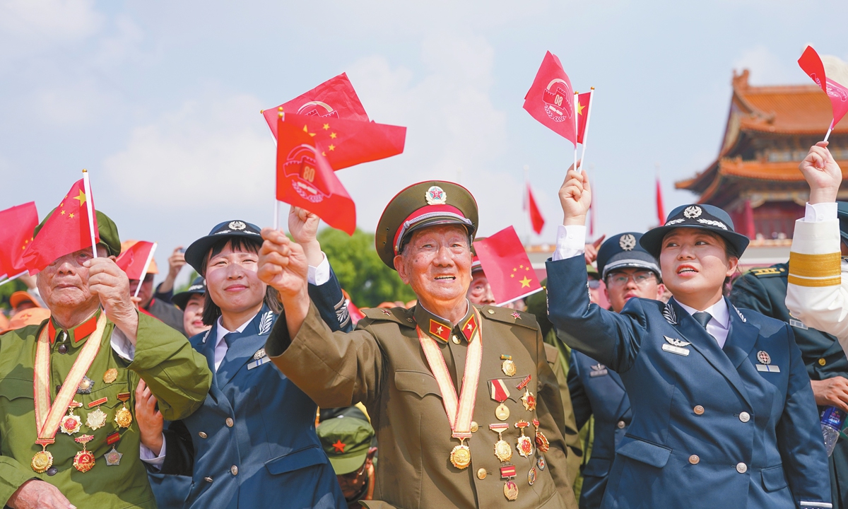 Some veterans wave flags during the ceremony marking the 80th anniversary of the victory of the Chinese People's War of Resistance Against Japanese Aggression and the World Anti-Fascist War. Photo: VCG