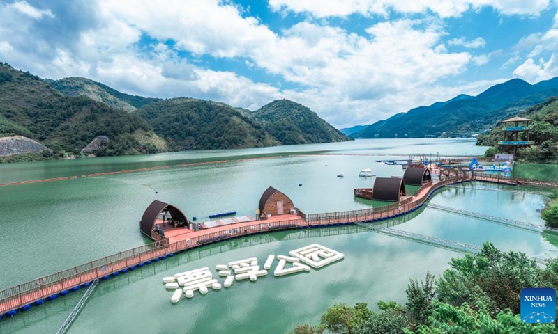 An aerial drone photo taken on Sept. 6, 2025 shows a view of a park in Xiongjiang Town of Minqing County, southeast China's Fujian Province. In recent years, Xiongjiang Town has been encouraging locals to renovate rural houses and utilize idle spaces to develop an ecological tourism industry by integrating characteristic agriculture, homestays, and rural sightseeing. This initiative has attracted a number of young entrepreneurs to start business. Currently, Xiongjiang Town receives an average of more than 1,700 trips daily, with the peak of over 18,700 trips in a single day during weekend and holiday period. (Photo: Xinhua)
