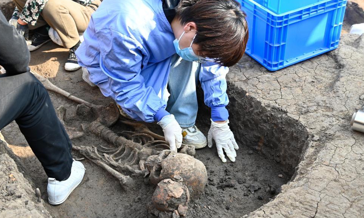 Archaeologists work at the Jiahu site in Central China's Henan Province. Photo: Xinhua News Agency