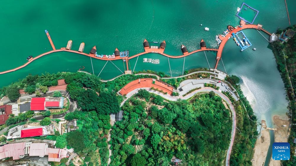 An aerial drone photo taken on Sept. 6, 2025 shows a view of a park in Xiongjiang Town of Minqing County, southeast China's Fujian Province. In recent years, Xiongjiang Town has been encouraging locals to renovate rural houses and utilize idle spaces to develop an ecological tourism industry by integrating characteristic agriculture, homestays, and rural sightseeing. This initiative has attracted a number of young entrepreneurs to start business. Currently, Xiongjiang Town receives an average of more than 1,700 trips daily, with the peak of over 18,700 trips in a single day during weekend and holiday period. (Photo: Xinhua)