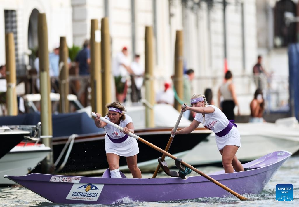 People take part in the Regata Storica boat race in Venice, Italy, Sept. 7, 2025. The Regata Storica is a historic annual boat parade and rowing race on the Grand Canal in Venice. (Photo: Xinhua)