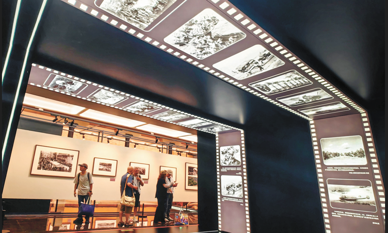 An exhibition featuring over 140 precious photographs documenting the Chinese People's War of Resistance Against Japanese Aggression, attracts many visitors in Shanghai on September 4, 2025. Photo: VCG