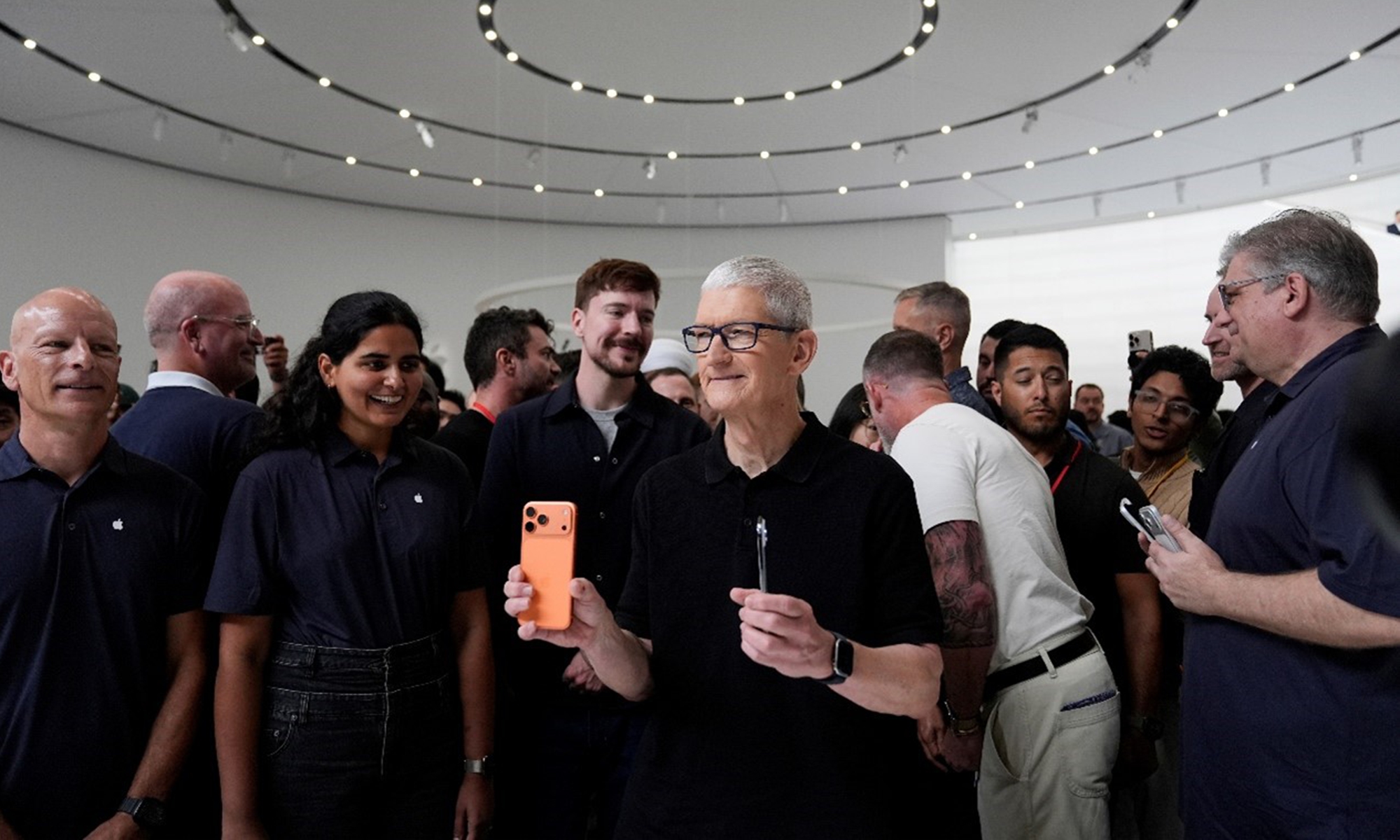 Apple CEO Tim Cook holds new iPhones during an announcement of new products at Apple Park on Tuesday, September 9, 2025, in Cupertino, California, US. Photo: VCG