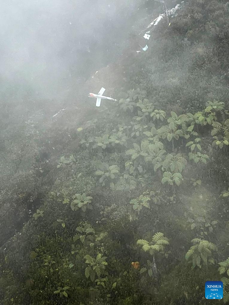 This photo provided by Indonesia's National Search and Rescue Agency (Basarnas) shows debris of a crashed helicopter in Central Papua, Indonesia, on Sept 10, 2025. A helicopter with four people on board crashed on Wednesday in Indonesia's Central Papua province. (Basarnas/Handout via Xinhua)