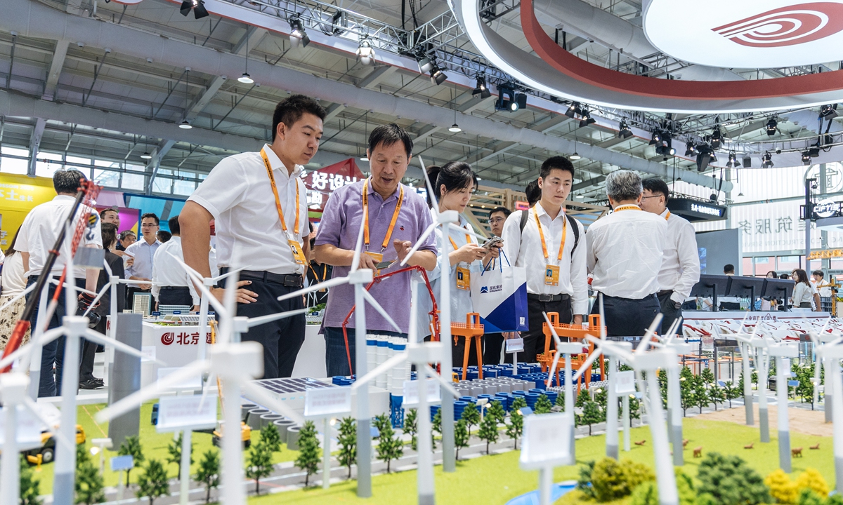 Visitors view a model showcasing scientific housing construction planning at the 2025 CIFTIS in Beijing on September 10, 2025. Photo: Li Hao/GT