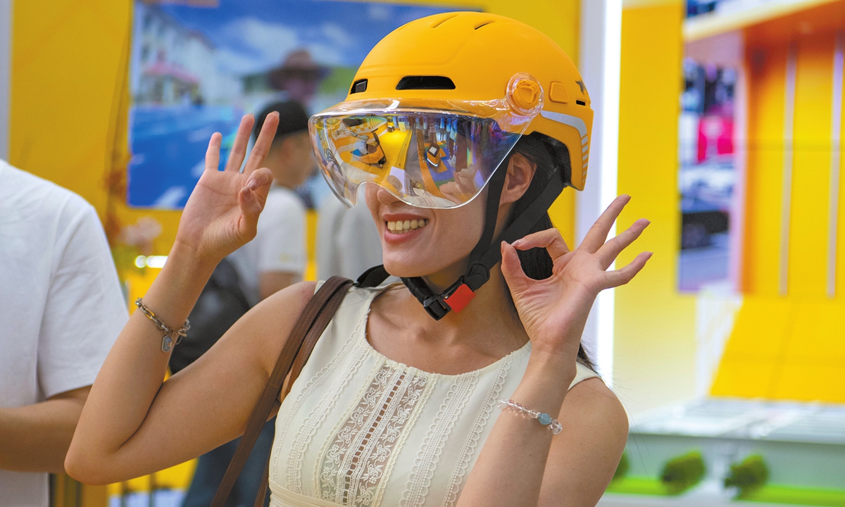 A visitor experiences a smart helmet at the 2025 CIFTIS in Beijing on September 10, 2025. Photo: IC