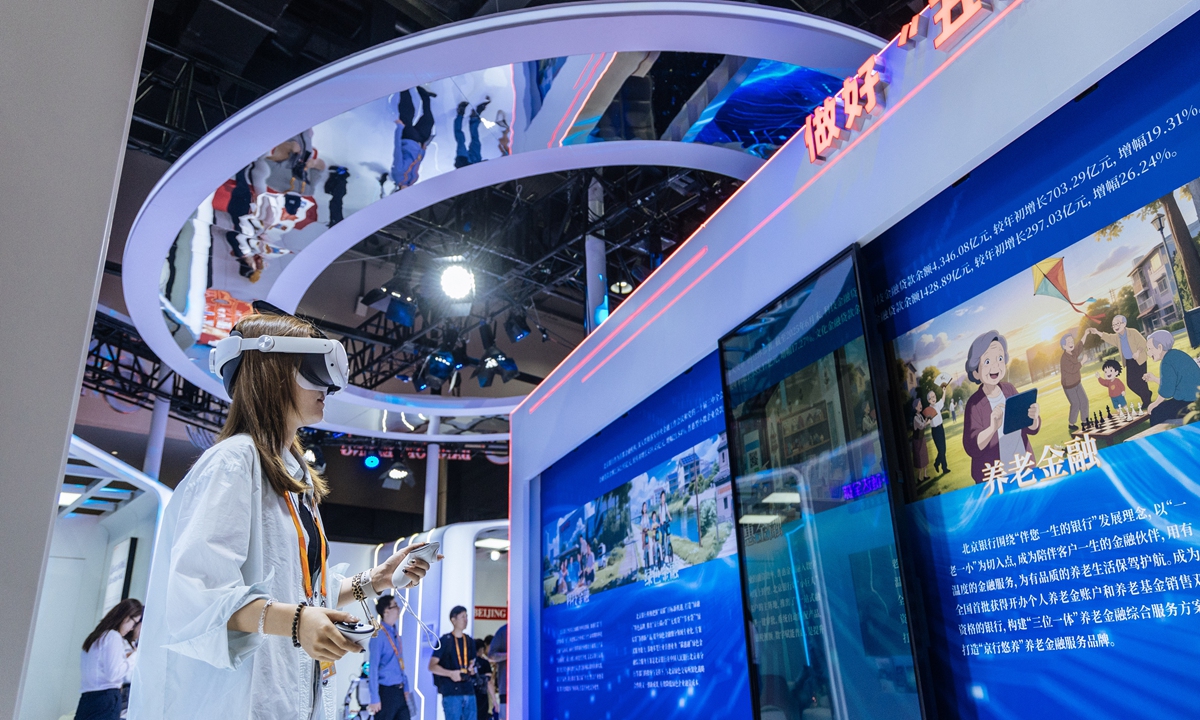 A visitor experiences VR glasses at the 2025 CIFTIS in Beijing on September 10, 2025. Photo: Li Hao/GT