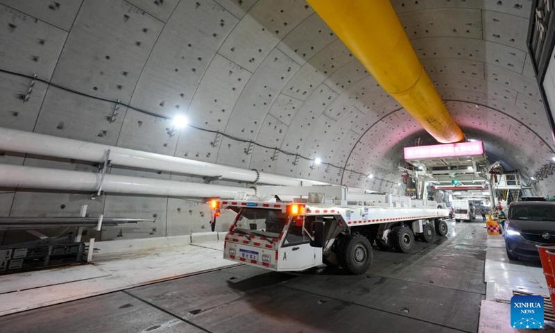 Staff work at the construction site of a Yellow River tunnel in Jinan, east China's Shandong Province, Sept. 12, 2025. With an excavation diameter of 15.06 meters, a shield machine has bored 1,626 meters in the south line of the Yellow River tunnel in Jinan as of Friday. The Yellow River tunnel has a total length of 3,888 meters, with 3,252 meters to be excavated using a shield machine. It is designed as a six-lane, bidirectional highway with a speed limit of 60 km per hour. (Photo: Xinhua)
