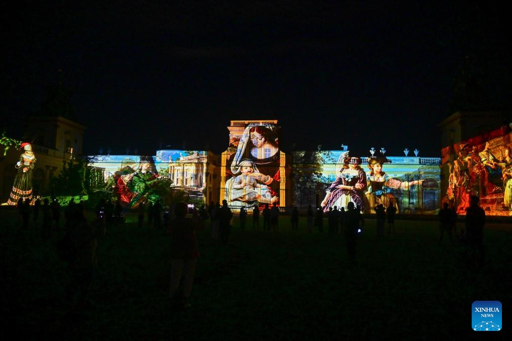 People watch the mapping show of Royal Collection Painting Alive powered by artificial intelligence at the Museum of King Jan III's Palace at Wilanow in Warsaw, Poland on Sept. 12, 2025. (Photo: Xinhua)