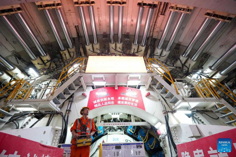 A man works at the construction site of a Yellow River tunnel in Jinan, east China's Shandong Province, Sept. 12, 2025. With an excavation diameter of 15.06 meters, a shield machine has bored 1,626 meters in the south line of the Yellow River tunnel in Jinan as of Friday. The Yellow River tunnel has a total length of 3,888 meters, with 3,252 meters to be excavated using a shield machine. It is designed as a six-lane, bidirectional highway with a speed limit of 60 km per hour. (Photo: Xinhua)
