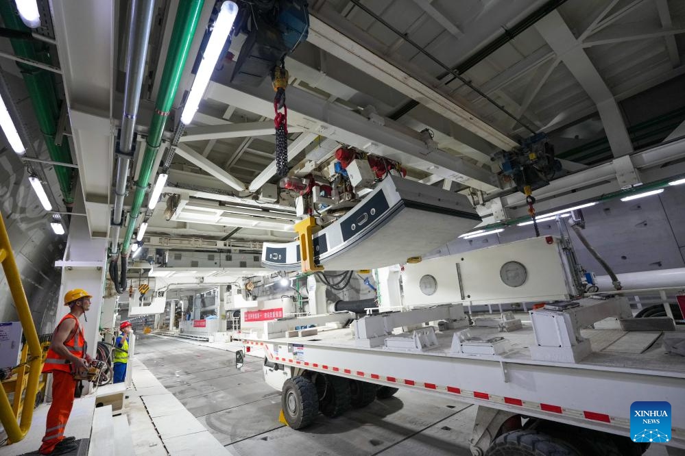Staff work at the construction site of a Yellow River tunnel in Jinan, east China's Shandong Province, Sept. 12, 2025. With an excavation diameter of 15.06 meters, a shield machine has bored 1,626 meters in the south line of the Yellow River tunnel in Jinan as of Friday. The Yellow River tunnel has a total length of 3,888 meters, with 3,252 meters to be excavated using a shield machine. It is designed as a six-lane, bidirectional highway with a speed limit of 60 km per hour. (Photo: Xinhua)
