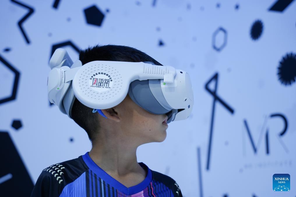 A kid tries a VR device at the Cultural & Tourism Services exhibition area of the 2025 China International Fair for Trade in Services (CIFTIS) at Shougang Park in Beijing, capital of China, Sept. 13, 2025. At the 2025 CIFTIS, a variety of cutting-edge technologies have enriched the exhibition, providing more interactive and immersing cultural and tourism experiences for visitors. (Photo: Xinhua)