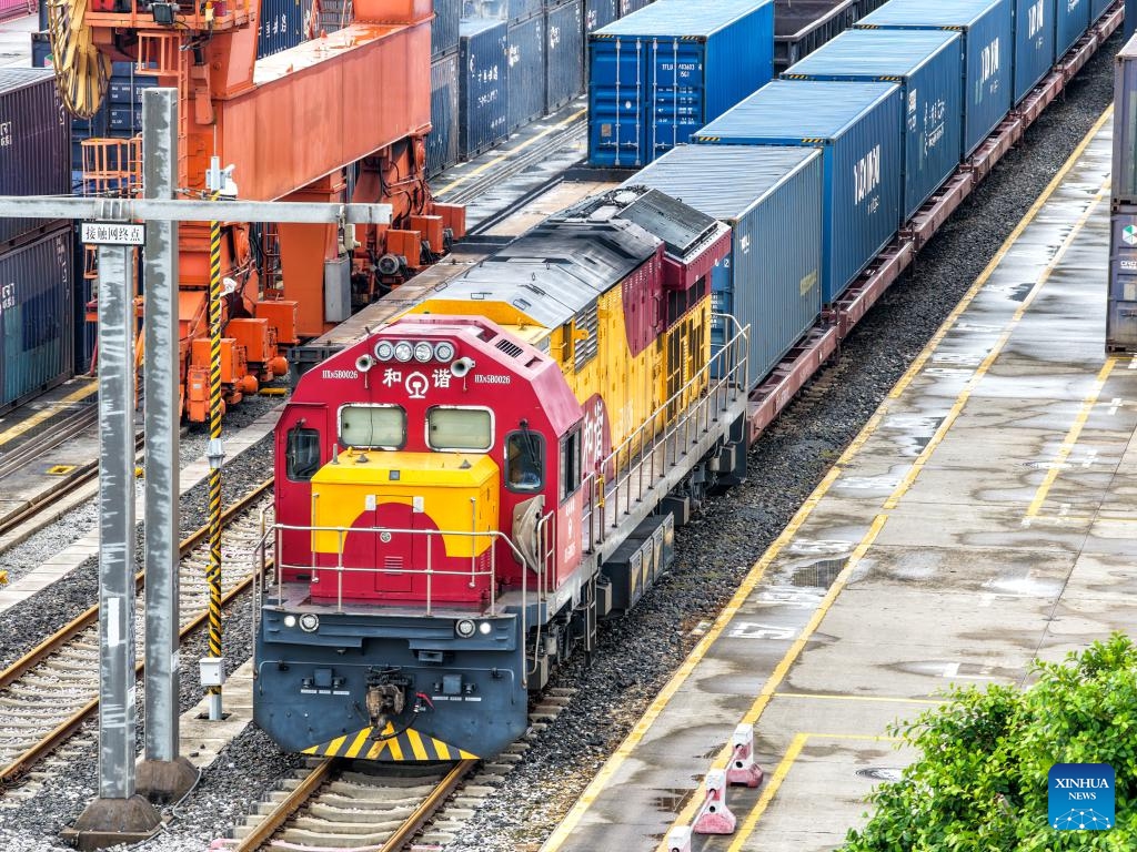 A drone photo taken on Sept. 13, 2025 shows a freight train bound for Central Asia loaded with auto parts, laptops and other goods waiting for departure at Tuanjiecun Station in Chongqing, southwest China. In the first eight months of this year, 35 freight trains have been dispatched from Chongqing to Central Asia, with a container volume of more than 3,000 TEUs and a total value of nearly 600 million yuan (about 84.2 million U.S. dollars), according to statistics from the Chongqing Railway Logistics Center. (Photo: Xinhua)