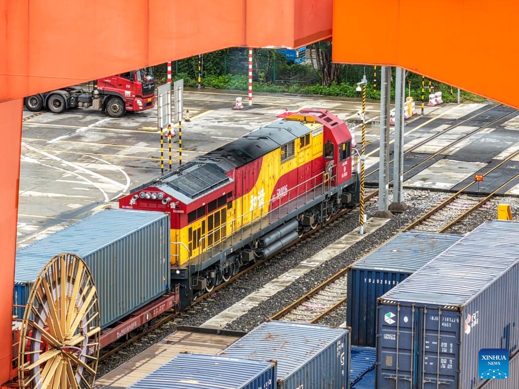 A drone photo taken on Sept. 13, 2025 shows a freight train bound for Central Asia loaded with auto parts, laptops and other goods waiting for departure at Tuanjiecun Station in Chongqing, southwest China. In the first eight months of this year, 35 freight trains have been dispatched from Chongqing to Central Asia, with a container volume of more than 3,000 TEUs and a total value of nearly 600 million yuan (about 84.2 million U.S. dollars), according to statistics from the Chongqing Railway Logistics Center. (Photo: Xinhua)