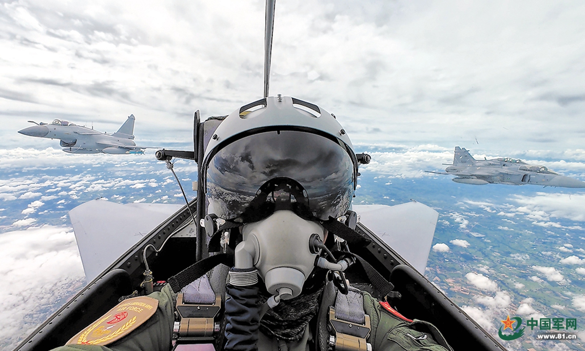 The PLA Air Force J-10C fighter jets conduct formation flight with the JAS39 Gripen of the Royal Thai Air Force during the China-Thailand 