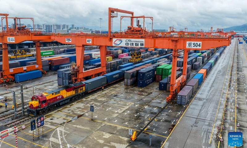 A drone photo taken on Sept. 13, 2025 shows a freight train bound for Central Asia loaded with auto parts, laptops and other goods waiting for departure at Tuanjiecun Station in Chongqing, southwest China. In the first eight months of this year, 35 freight trains have been dispatched from Chongqing to Central Asia, with a container volume of more than 3,000 TEUs and a total value of nearly 600 million yuan (about 84.2 million U.S. dollars), according to statistics from the Chongqing Railway Logistics Center. (Photo: Xinhua)