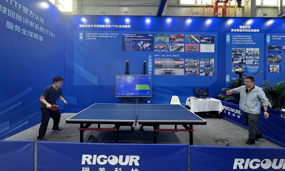 Two visitors try out an intelligent table tennis training device during the ongoing China International Fair for Trade in Services in Beijing on September 11, 2025. Photo: Chen Qingrui/GT