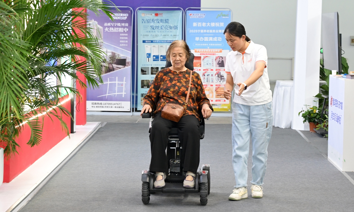 An elder tries out a assistive devices at the 2025 Ningxia Senior Service Expo & Conference on September 14, 2025. Photo: VCG