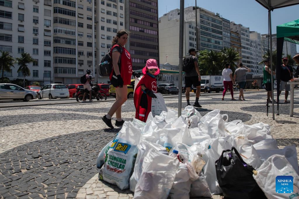 Volunteers place collected trash together at Copacabana Beach in Rio de Janeiro, Brazil, Sept. 20, 2025. World Cleanup Day is an annual global event that is marked every third Saturday in September with the aim of combating the global solid waste problem. (Photo: Xinhua)