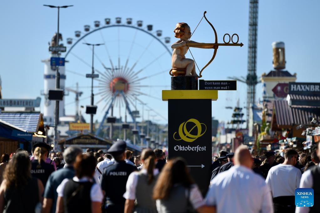 People attend the Oktoberfest in Munich, Germany, Sept. 20, 2025. The 190th Oktoberfest, one of the largest folk festivals in Germany, opened on Saturday in Munich, with mayor Dieter Reiter tapping the first barrel of beer as a tradition. This year's festival will last until Oct. 5. (Photo: Xinhua)