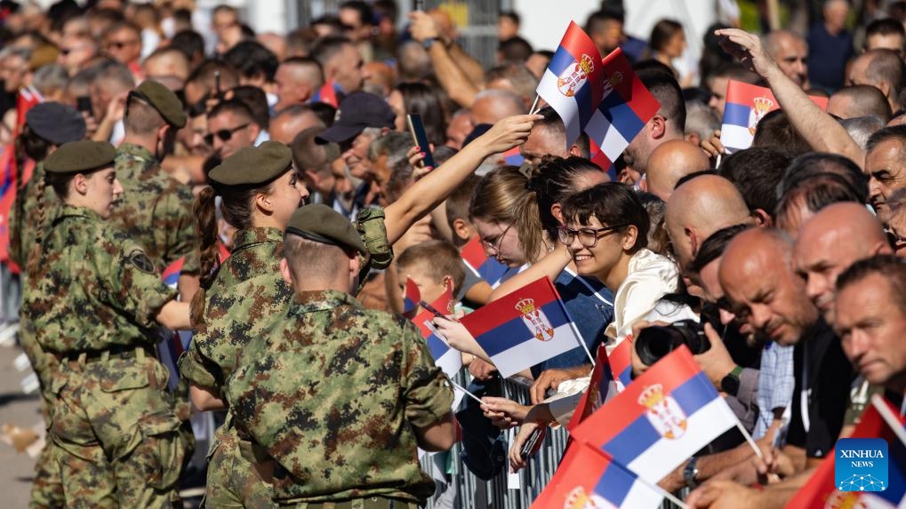 People interact with military personnel during a military parade marking the Day of Serbian Unity, Freedom and the National Flag in Belgrade, Serbia, Sept. 20, 2025. Serbia showcased its military strength on Saturday with the Power of Unity parade held in front of the Palace of Serbia, marking the Day of Serbian Unity, Freedom and the National Flag. According to the Ministry of Defence, the parade brought together about 10,000 personnel and featured some 2,500 pieces of weaponry and equipment, including more than 600 vehicles, 70 aircraft and 20 vessels. (Photo: Xinhua)