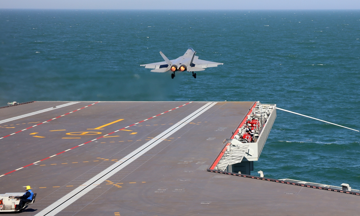 A J-35 stealth fighter jet takes off from the PLA Navy's aircraft carrier Fujian using the electromagnetic catapult. This captures the moment the aircraft speeds off the deck. Photo: Li Tang