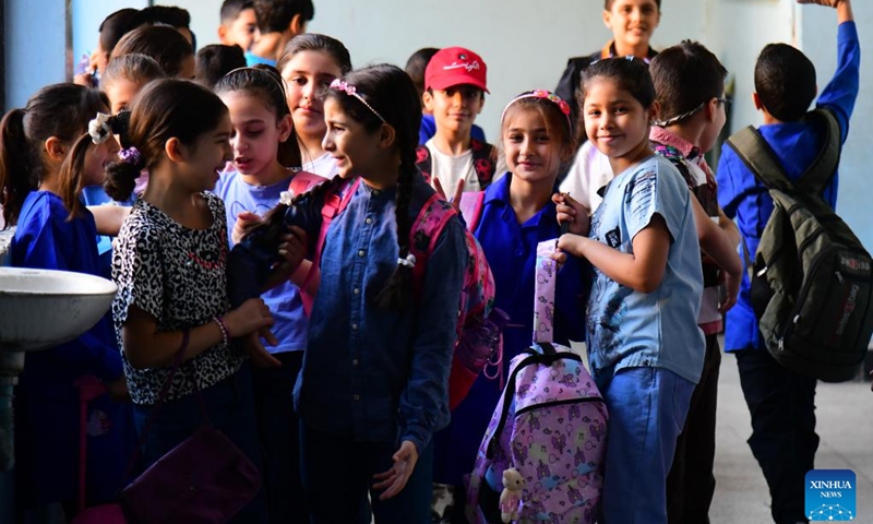 Students are seen at a school courtyard on the first day of new academic year in Damascus, Syria, on Sept. 21, 2025. The new academic year began with about 12,000 schools open on Sunday across the country. (Photo: Xinhua)