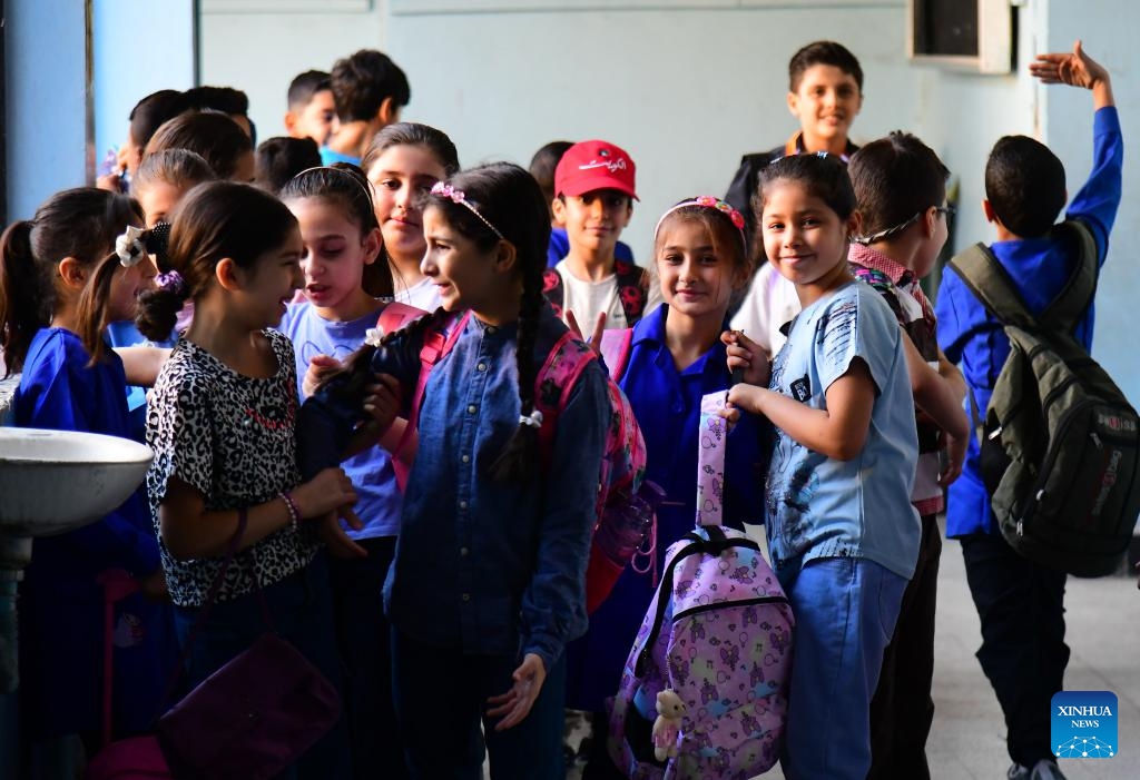 Students are seen at a school courtyard on the first day of new academic year in Damascus, Syria, on Sept. 21, 2025. The new academic year began with about 12,000 schools open on Sunday across the country. (Photo: Xinhua)