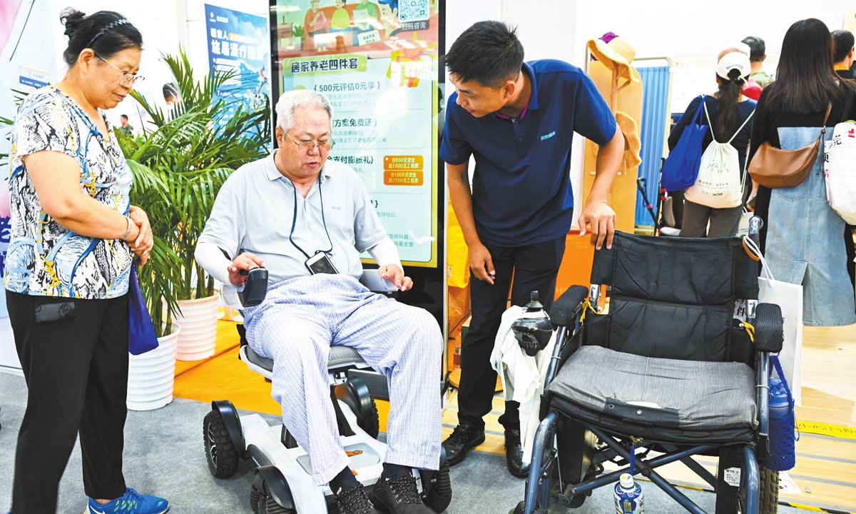 An elderly visitor experiences an intelligent wheelchair at the 2025 CIFTIS in Beijing on September 13, 2025. Photo: VCG