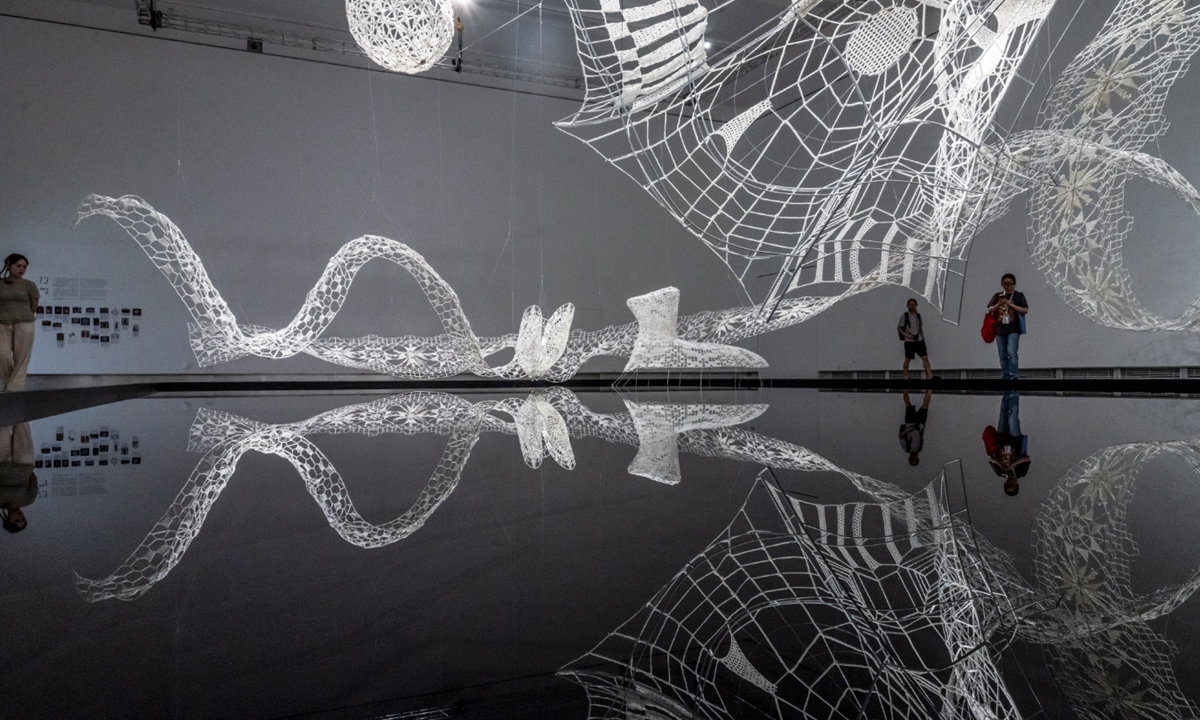 Visitors explore the 5th Hangzhou Triennial of Fibre Art in Hangzhou, East China's Zhejiang Province on September 23, 2025. After 12 years of development, the Triennial has become an important exchange platform for global fiber art and a key stage for China's fiber art to be displayed to the world. The exhibition will run until November 2. Photo: VCG