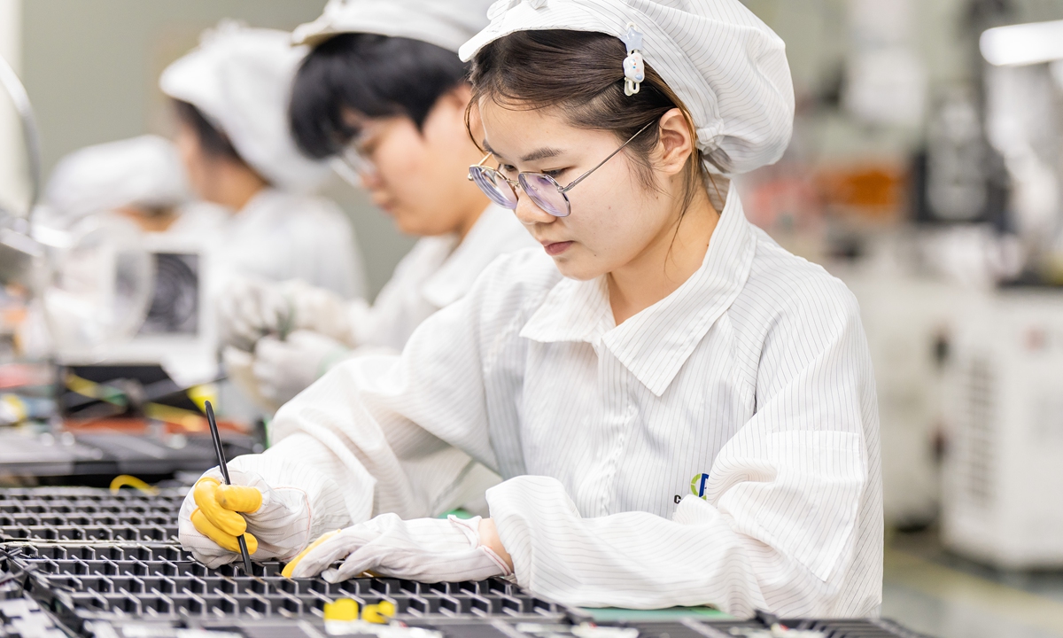Workers make lithium batteries for domestic and international clients at a company in Hai'an, Nantong, East China's Jiangsu Province, on September 24, 2025. According to Nanjing Customs, from January to August, Jiangsu exported lithium batteries worth 63.46 billion yuan ($8.9 billion), up 45.7 percent year-on-year. Photo: VCG
